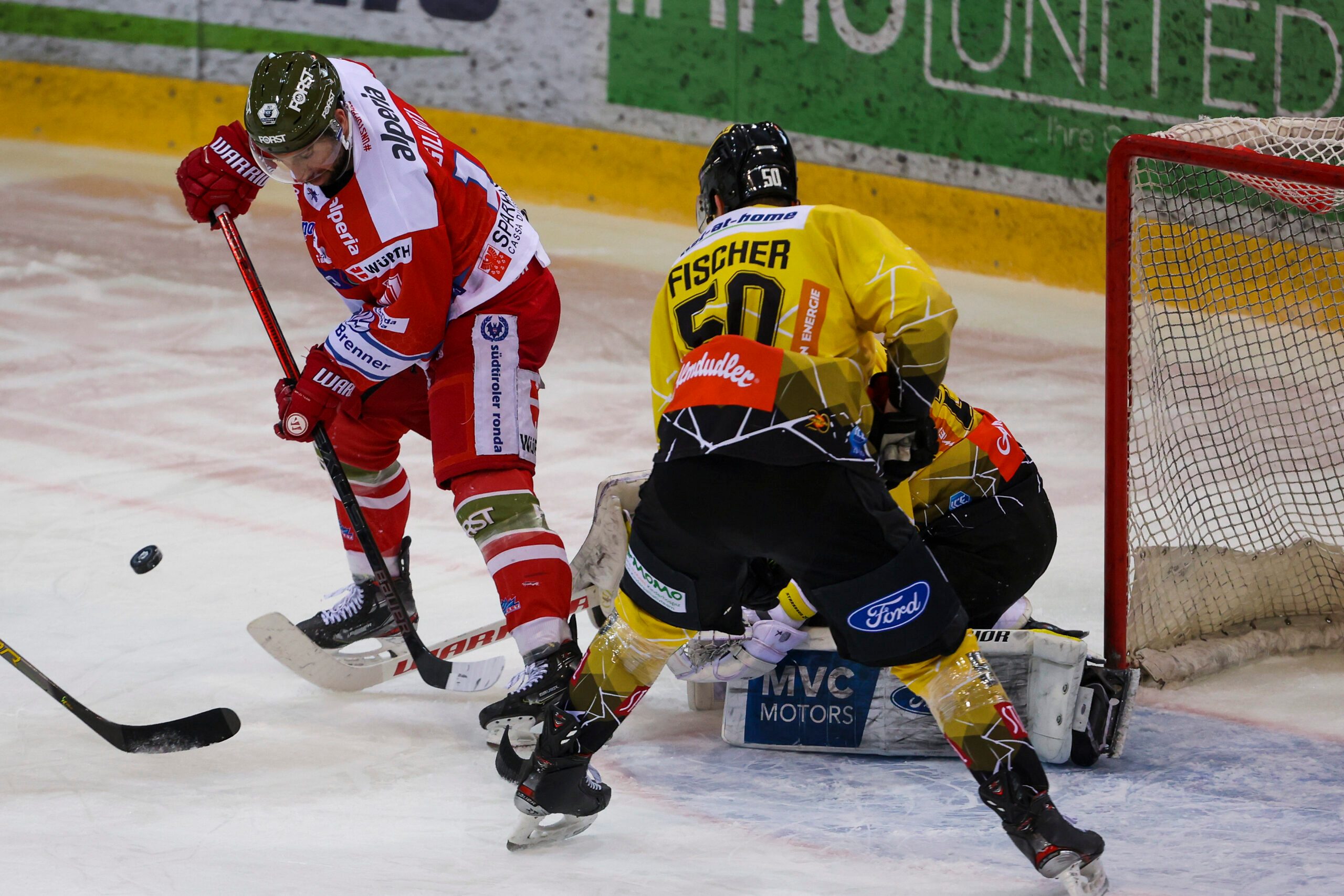 VIENNA,AUSTRIA,07.APR.21 - ICE HOCKEY - ICE Hockey League, play off, semifinal, EC Vienna Capitals vs HC Bozen. Image shows Stefano Giliati (Bozen) and Mario Fischer (Capitals).